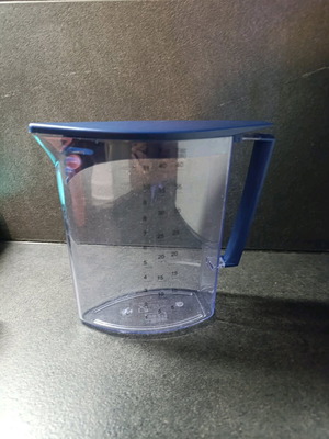 IKEA jug with lid and measuring cup used