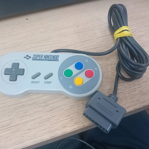 Super Nintendo 1990 console with 2 controllers and 3 games