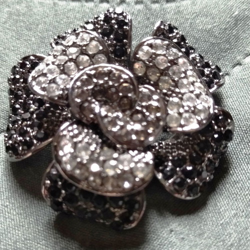 Vintage brooch with black and silver rhinestones, flower shape, like new