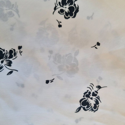 White fabric with black flowers for dress