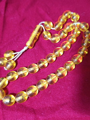 Worry beads with insects inside beads, unknown material