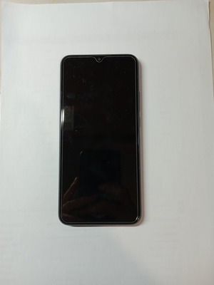 Redmi 9 64GB used smartphone with 2 cases and 2 screen protectors