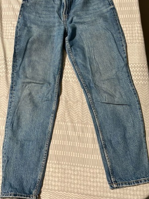 Bershka blue jeans used, size M 38 10, with mark on left leg
