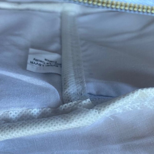 White toiletry bag new with iridescent golden threads
