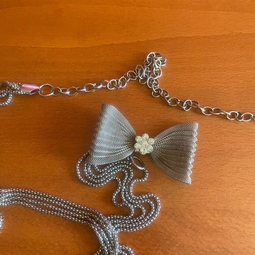 Metal belt like new, silver with bow and rhinestones