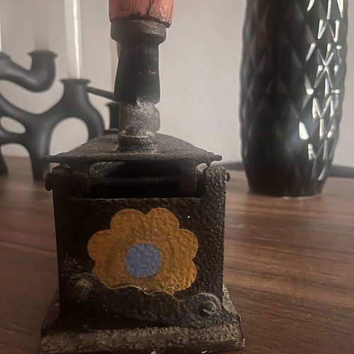 Cast iron charcoal iron used with painted flowers