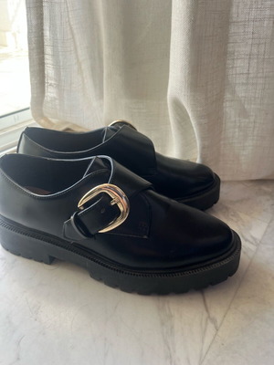 Women’s black H&M mules with high sole and gold buckle, like new, size 37