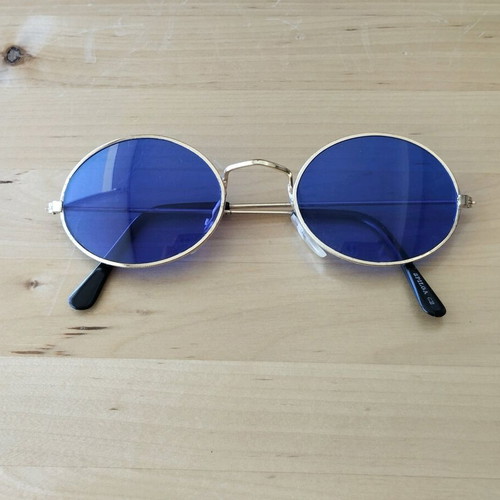 Oval sunglasses new with blue lenses and golden frames