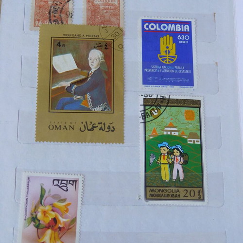 Red album with worldwide collectible stamps