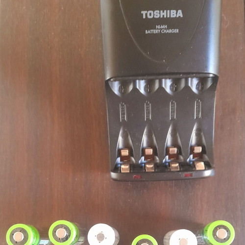Rechargeable AA batteries with 4-slot charger like new