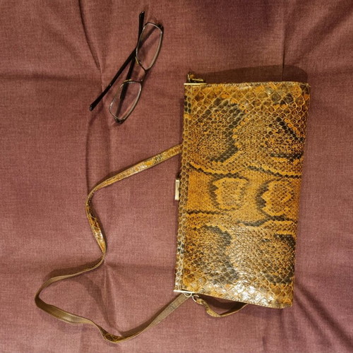 Crossbody bag used with python print leather pattern