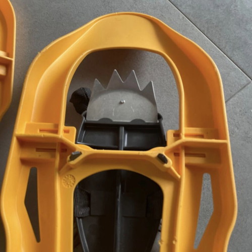 Sneka snowshoes used for hiking with metal crampons