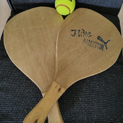 Wooden beach rackets used with new ball
