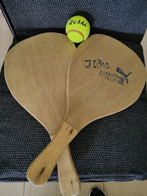 Wooden beach rackets used with new ball