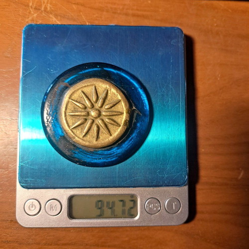 Paperweight with Vergina Star used, brass on glass base