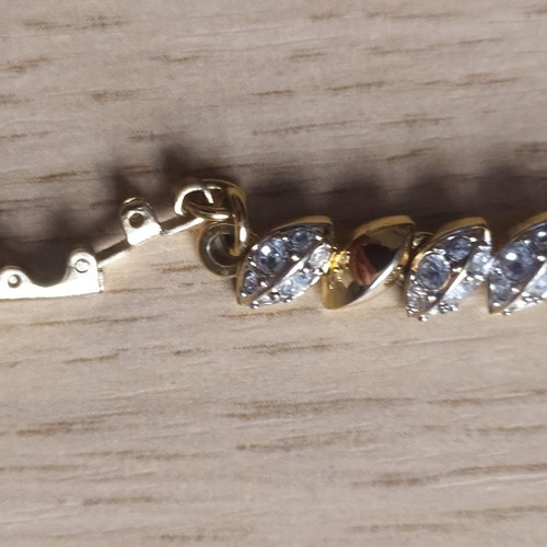 Swarovski bracelet like new, gold tone with crystals