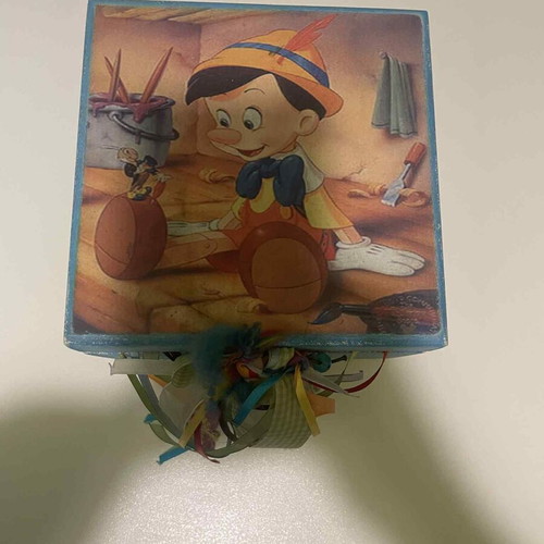 Wooden box with Pinocchio figure used