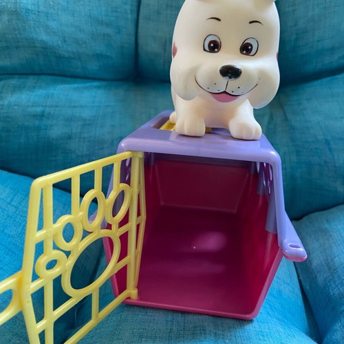 Simba collectible dog figure with carrying cage used