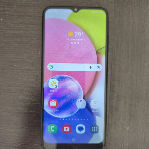 Samsung A03s smartphone with 2 cases