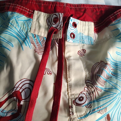Aggressive men's swim shorts size L like new, multicolor tribal print