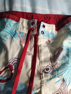 Aggressive men's swim shorts size L like new, multicolor tribal print