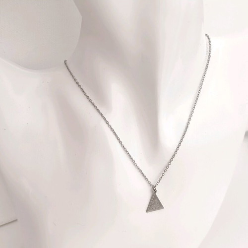 Minimal handmade steel chain necklace with a triangle pendant featuring a carved eye