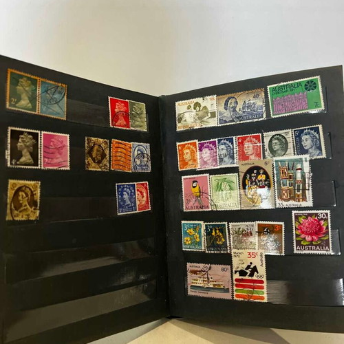 Stamp album with various collectible stamps used, 19x14.5 cm