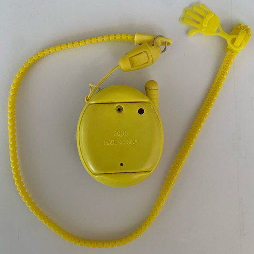 Tamagotchi 2006 yellow red flower used handheld virtual pet