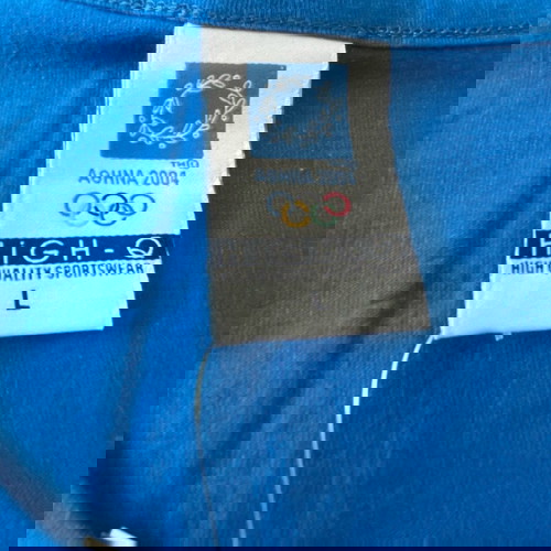 Αφόρετη επώνυμη μπλούζα ολυμπιακών αγώνων με το στεφάνι