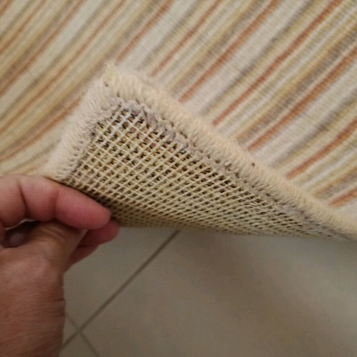 Used rug with beige, mustard, brown and terracotta stripes