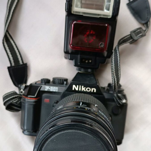 Nikon F301 camera used with 35-135 lens and flash