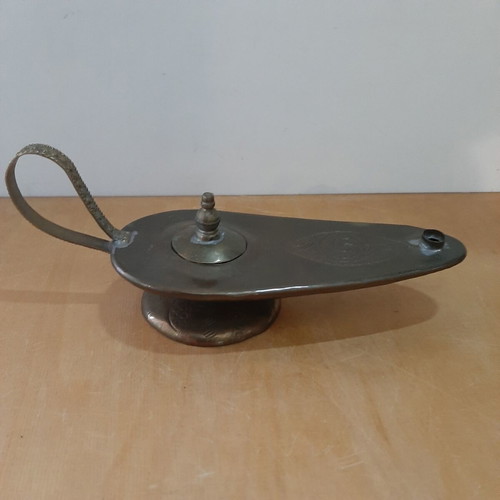 Copper oil lamp used with carved decorations and patina
