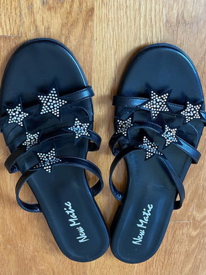 New Matic leather sandals black with star design like new size 38