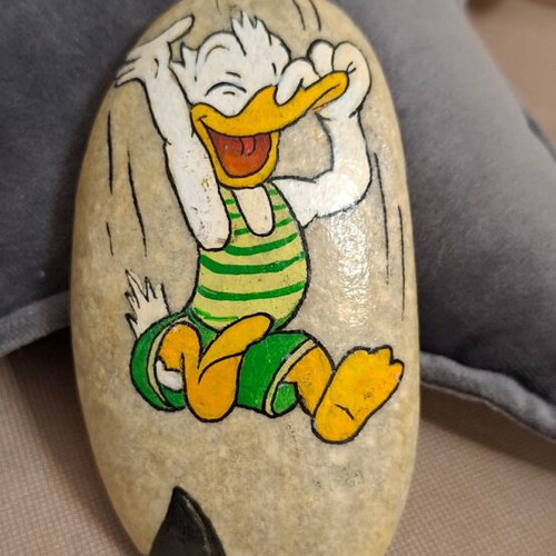 Hand-painted stone with Donald, new