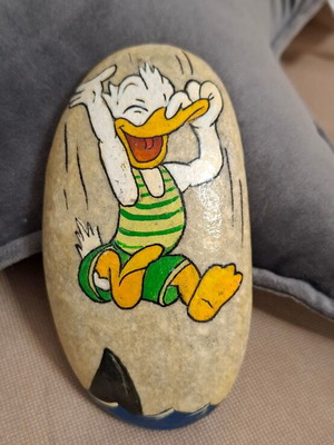 Hand-painted stone with Donald, new