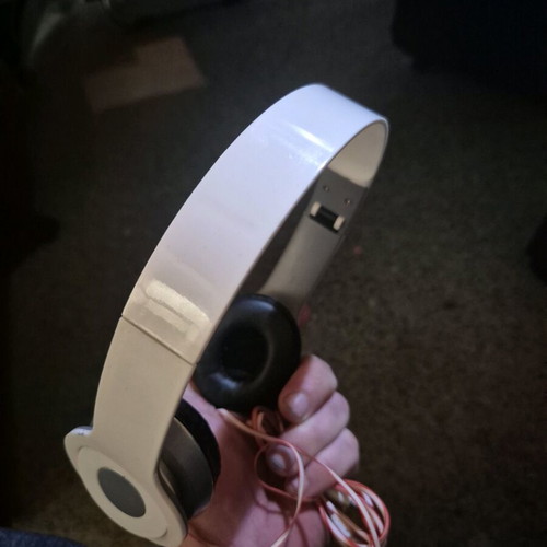 Foldable on-ear headphones used, white with silver details