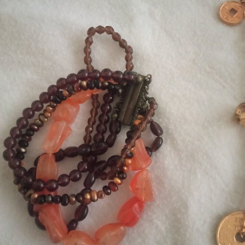 Faux jewelry used, 3 necklaces and 1 bracelet