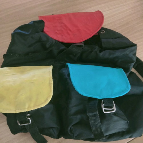 Backpack used with colorful cheerful designs and two front pockets