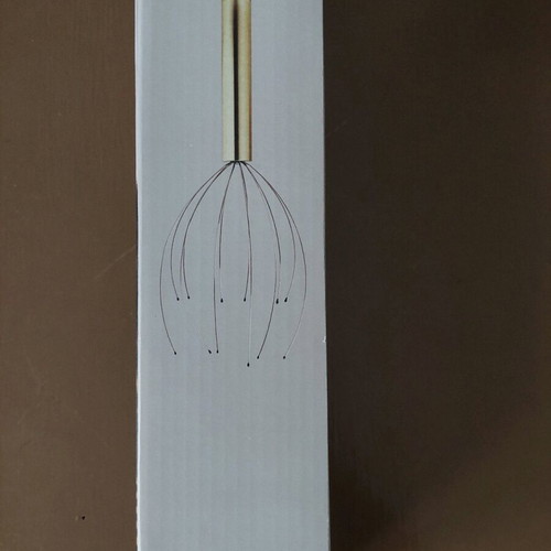 Head massager new, opened for battery placement