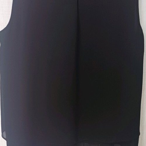 Sleeveless women's blouse black like new with ruffles and sheer detail