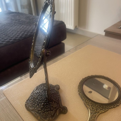Set of two brass mirrors, table and hand used