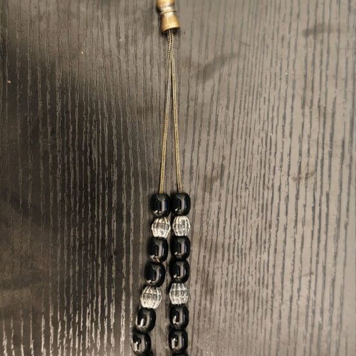 Black worry beads used with metal chain and details