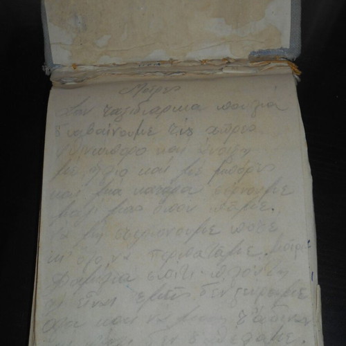 Handwritten notebook with rebetiko lyrics and diet recipes used