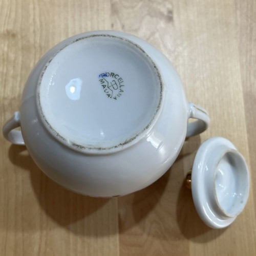 Porcelain tea set used with floral pattern, teapot, creamer, sugar bowl