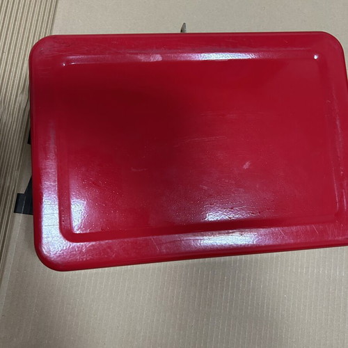 Red metal cash box with lock and key