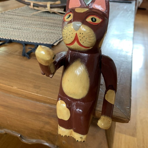 Wooden sitting cat with movable arms, like new, ~20 cm