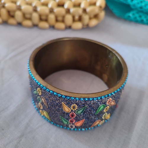 Ethnic bracelet made of brass with intricate colorful designs like new