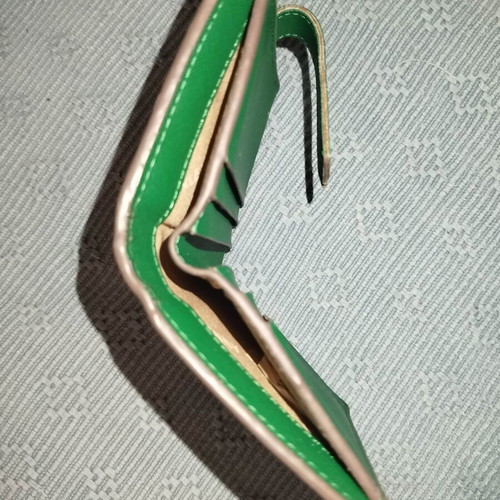 Small green wallet used