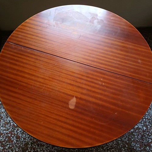 Round table with red tablecloth used, vintage wood design