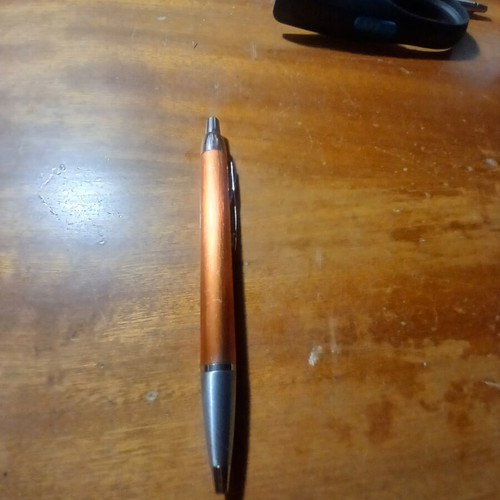 Parker pen like new, orange bronze color